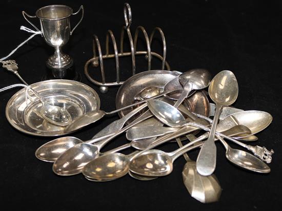 Various Georgian and later silver teaspoons, a small toast rack, two pin trays, a small trophy cup, childs pusher, etc.